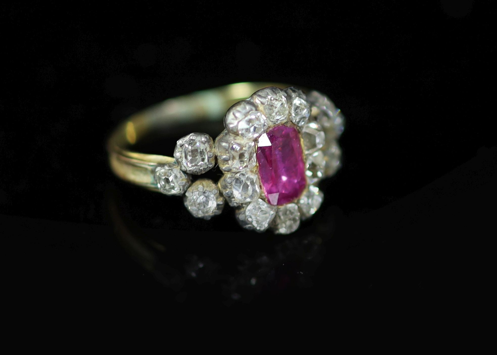 A George IV gold and silver, foil backed pink stone and old mine cut diamond set cluster memorial ring